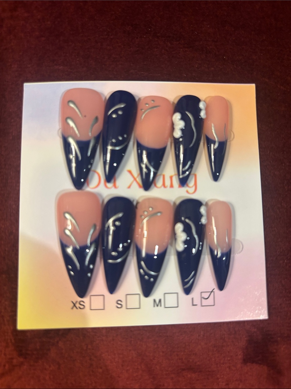 Long Stiletto Press-On Nails in Nude and Navy with White Accents